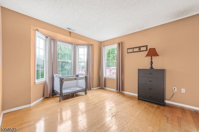 40 Nathan Dr, Old Bridge Twp, NJ 08857 - living area with a textured ceiling, baseboards, and wood finished floors