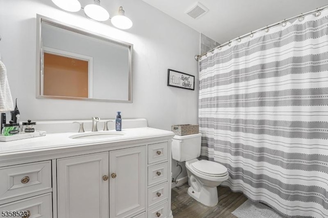 40 Nathan Dr, Old Bridge Twp, NJ 08857 - bathroom with toilet, vanity, wood finished floors, and curtained shower