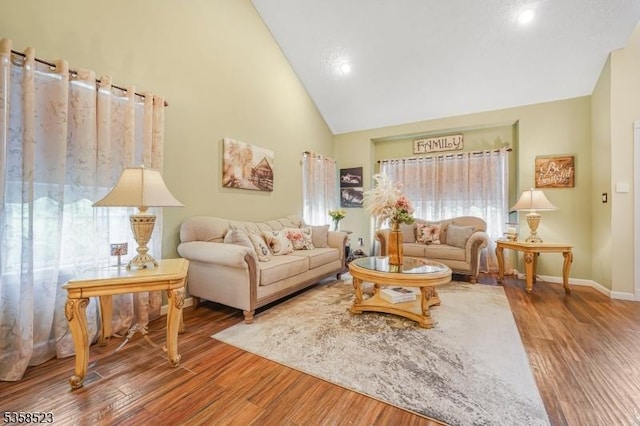 40 Nathan Dr, Old Bridge Twp, NJ 08857 - living area with wood finished floors, high vaulted ceiling, plenty of natural light, baseboards, and recessed lighting