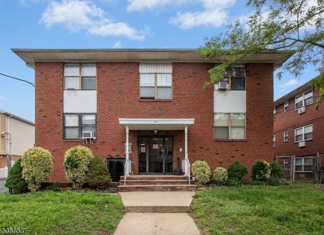 35 E Price St Unit 5, Linden City, NJ 07036 - view of front of home featuring brick siding, a front lawn, and cooling unit