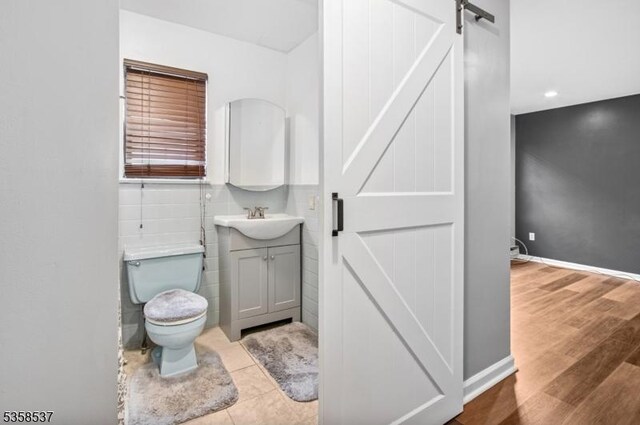 35 E Price St Unit 5, Linden City, NJ 07036 - bathroom featuring toilet, vanity, wood finished floors, baseboards, and recessed lighting