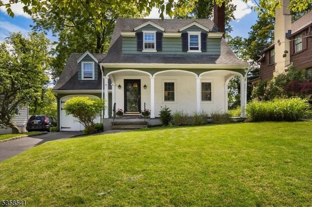 22 Bailey Rd, Millburn Twp, NJ 07041 - view of front of house with a chimney, driveway, roof with shingles, a front yard, and a garage
