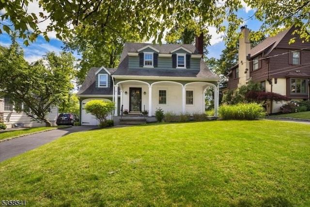 22 Bailey Rd, Millburn Twp, NJ 07041 - view of front of home with a front lawn, a chimney, asphalt driveway, covered porch, and a shingled roof