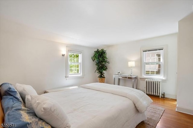 22 Bailey Rd, Millburn Twp, NJ 07041 - bedroom featuring radiator, wood finished floors, and baseboards