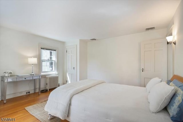 22 Bailey Rd, Millburn Twp, NJ 07041 - bedroom with radiator heating unit and wood finished floors