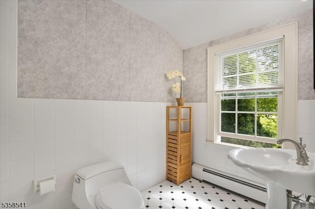 22 Bailey Rd, Millburn Twp, NJ 07041 - bathroom featuring tile walls, a baseboard heating unit, tile patterned floors, toilet, and a wainscoted wall