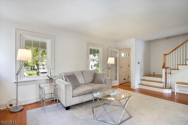 22 Bailey Rd, Millburn Twp, NJ 07041 - living area with healthy amount of natural light, stairway, and wood finished floors