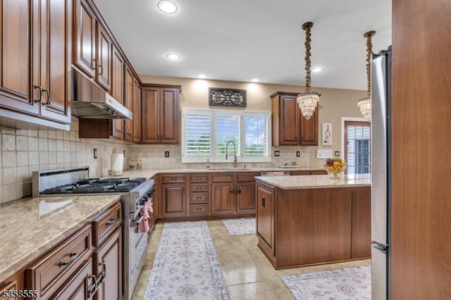 7 Montaine Pl, Clinton Twp, NJ 08833 - kitchen featuring high end stainless steel range oven, a sink, under cabinet range hood, backsplash, and light stone counters