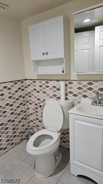 118 Prospect St, Franklin Twp, NJ 08873 - bathroom with vanity, toilet, and tile patterned flooring