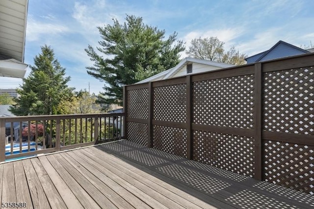 wooden terrace featuring a pool