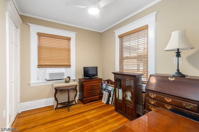 office area with ceiling fan, cooling unit, wood finished floors, crown molding, and baseboards