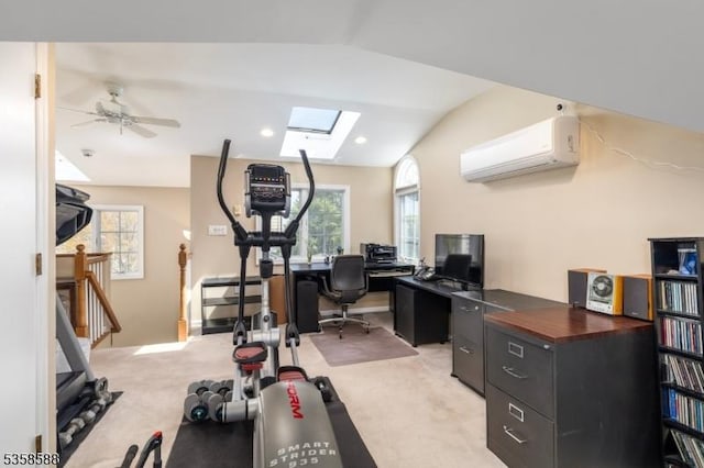 exercise area with a wall mounted air conditioner, light carpet, vaulted ceiling, a skylight, and a ceiling fan