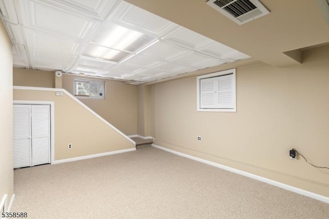 below grade area with carpet flooring and baseboards