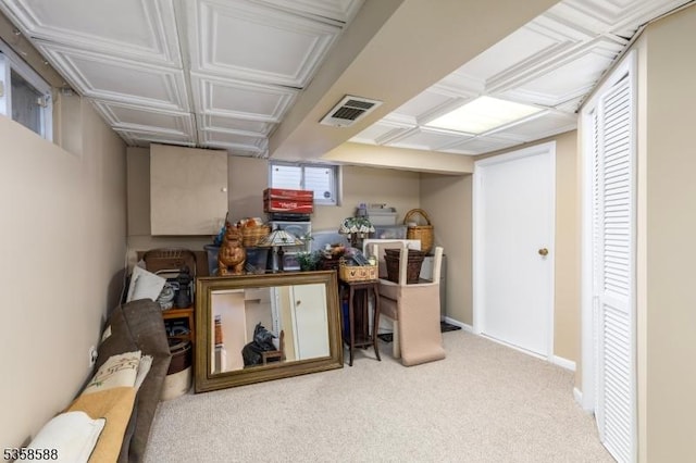 below grade area featuring carpet and baseboards