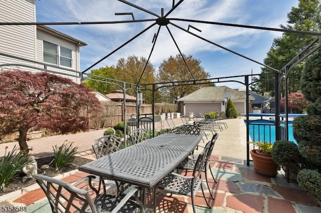 view of patio with outdoor dining space and fence