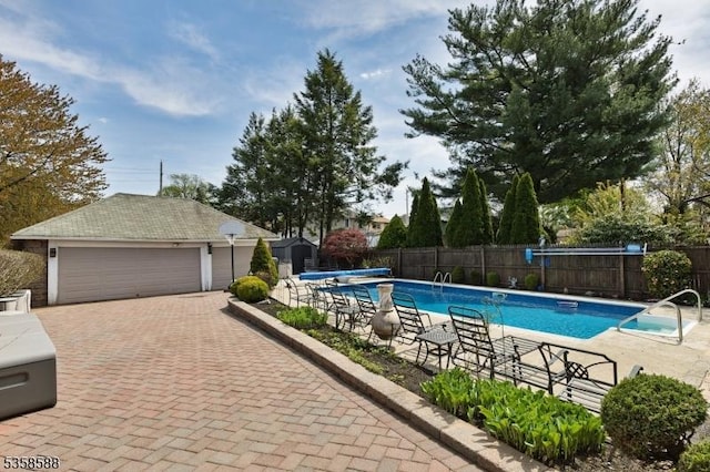 view of pool featuring fence and an outdoor structure