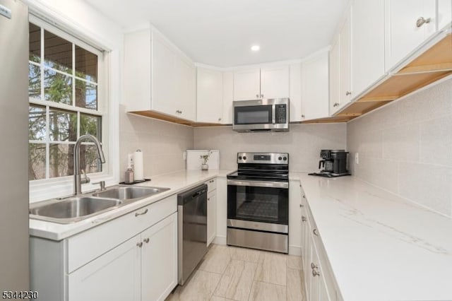 620 Hemlock Rd, Hampton Twp, NJ 07860 - kitchen with appliances with stainless steel finishes, a sink, white cabinetry, recessed lighting, and tasteful backsplash