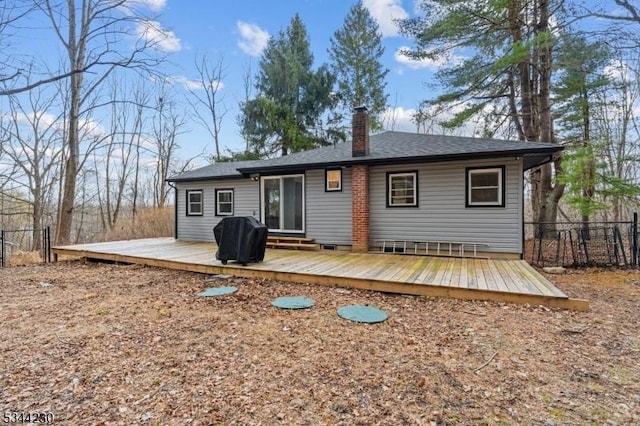 620 Hemlock Rd, Hampton Twp, NJ 07860 - back of property featuring a chimney, a wooden deck, and roof with shingles