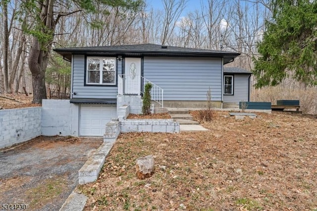 620 Hemlock Rd, Hampton Twp, NJ 07860 - rear view of house with an attached garage and driveway