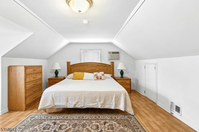 718 Pine St, Roselle Park Boro, NJ 07204 - bedroom with wood finished floors, lofted ceiling, and an AC wall unit