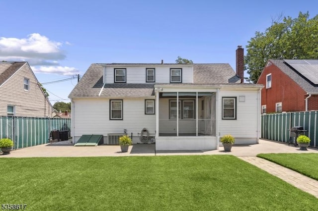 718 Pine St, Roselle Park Boro, NJ 07204 - back of property featuring a sunroom, a patio, and a fenced backyard