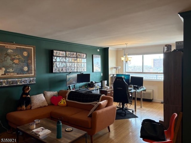 100 Manhattan Ave, Union City, NJ 07087 - living room with ornamental molding, a desk, wood finished floors, a chandelier, and radiator