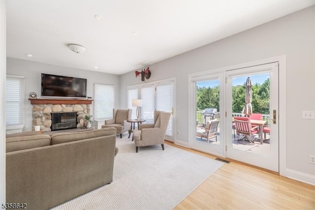 11 Brookside Dr, Peapack Gladstone Boro, NJ 07934 - living room with light wood-style flooring, plenty of natural light, baseboards, a fireplace, and recessed lighting
