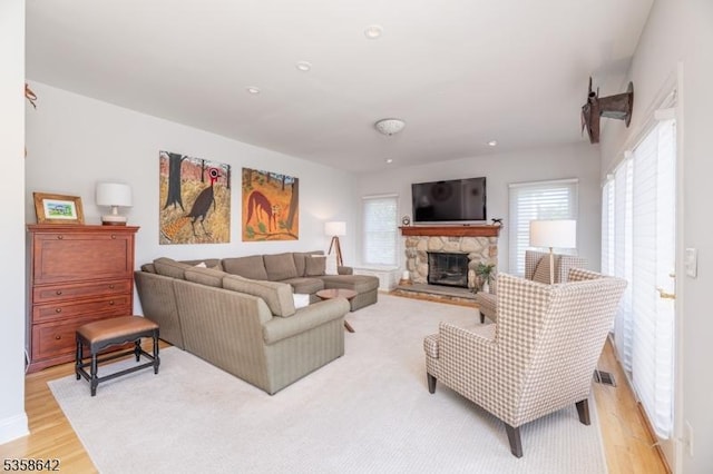 11 Brookside Dr, Peapack Gladstone Boro, NJ 07934 - living room featuring healthy amount of natural light, light wood-style flooring, and a fireplace