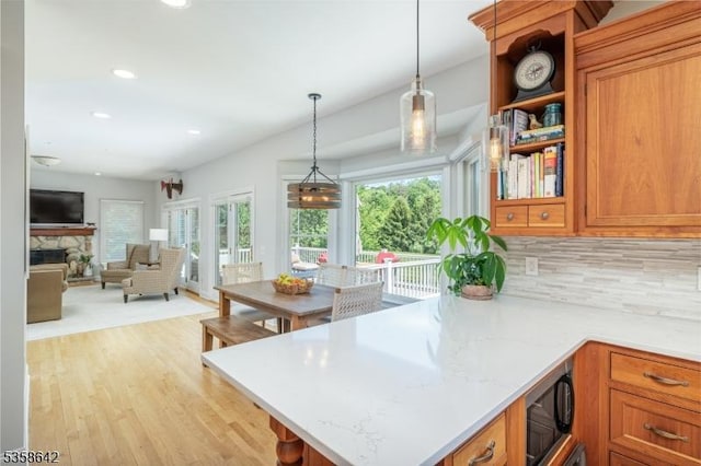 11 Brookside Dr, Peapack Gladstone Boro, NJ 07934 - kitchen with plenty of natural light, decorative backsplash, pendant lighting, black microwave, and recessed lighting