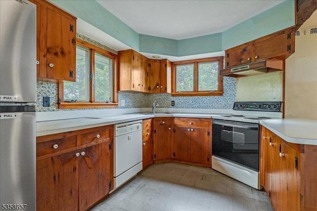 18 Pottersville Rd, Peapack Gladstone Boro, NJ 07934 - kitchen with freestanding refrigerator, white dishwasher, range with electric stovetop, light countertops, and decorative backsplash