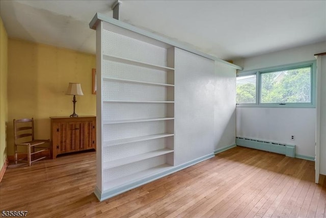 18 Pottersville Rd, Peapack Gladstone Boro, NJ 07934 - unfurnished bedroom with baseboard heating and hardwood / wood-style floors
