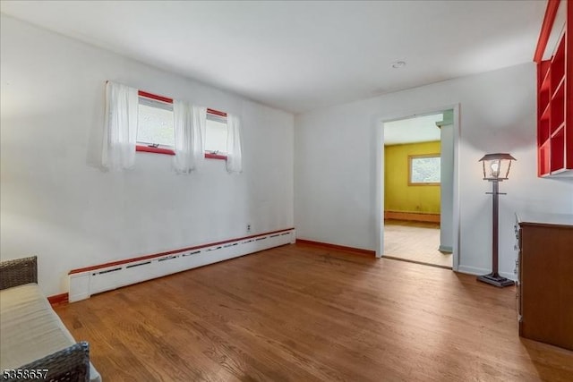 18 Pottersville Rd, Peapack Gladstone Boro, NJ 07934 - empty room with a baseboard heating unit, wood finished floors, and healthy amount of natural light