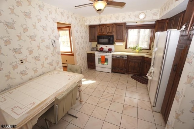 293 Oak Ridge Rd, Clark Twp, NJ 07066 - kitchen with white appliances, ceiling fan, wallpapered walls, light countertops, and healthy amount of natural light