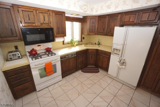293 Oak Ridge Rd, Clark Twp, NJ 07066 - kitchen featuring white appliances, wallpapered walls, light countertops, and a sink