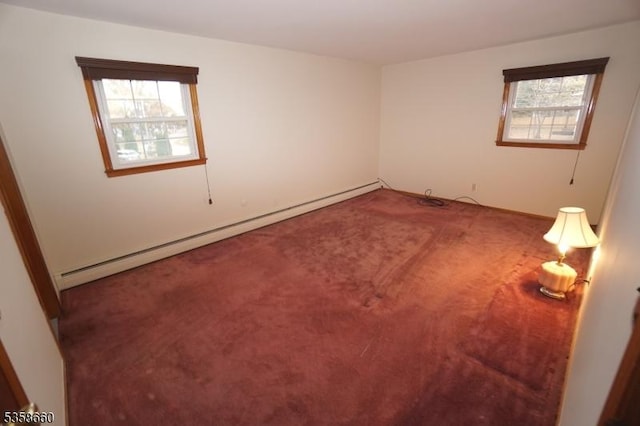 293 Oak Ridge Rd, Clark Twp, NJ 07066 - spare room featuring a baseboard radiator, carpet, and plenty of natural light