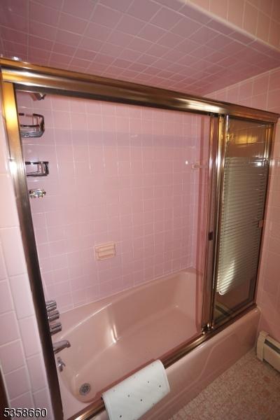 293 Oak Ridge Rd, Clark Twp, NJ 07066 - full bath with enclosed tub / shower combo and baseboard heating