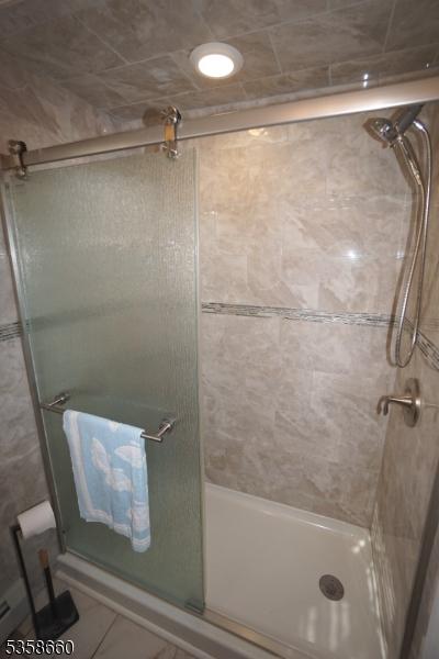 293 Oak Ridge Rd, Clark Twp, NJ 07066 - bathroom featuring a shower stall
