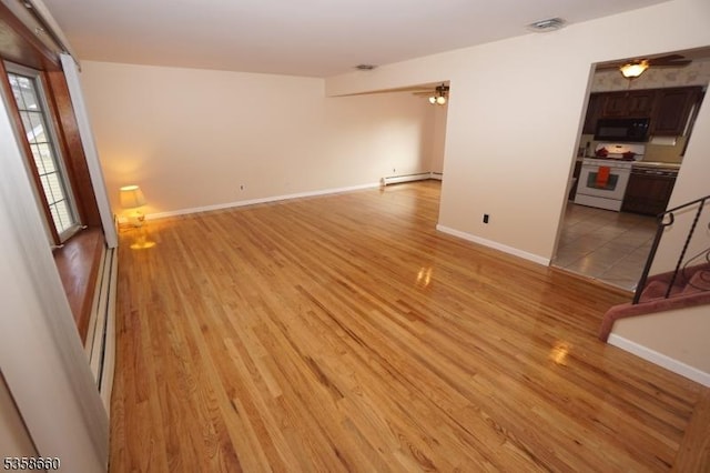 293 Oak Ridge Rd, Clark Twp, NJ 07066 - unfurnished room featuring a ceiling fan, a baseboard radiator, light wood-style floors, and baseboards