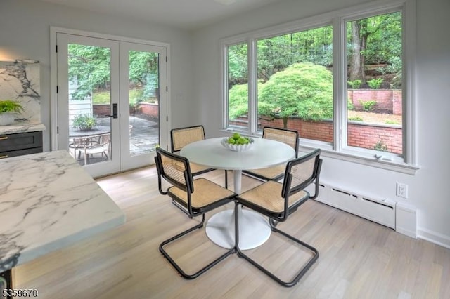 25 Highland Ave, Peapack Gladstone Boro, NJ 07931 - dining area with french doors, light wood-style flooring, and a baseboard heating unit