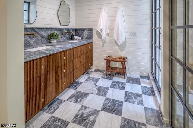 25 Highland Ave, Peapack Gladstone Boro, NJ 07931 - bathroom with double vanity, healthy amount of natural light, and wood walls