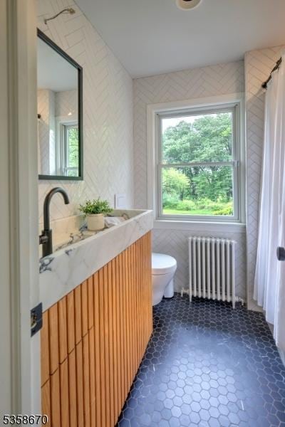25 Highland Ave, Peapack Gladstone Boro, NJ 07931 - full bathroom featuring radiator heating unit, toilet, tile walls, vanity, and a shower with curtain