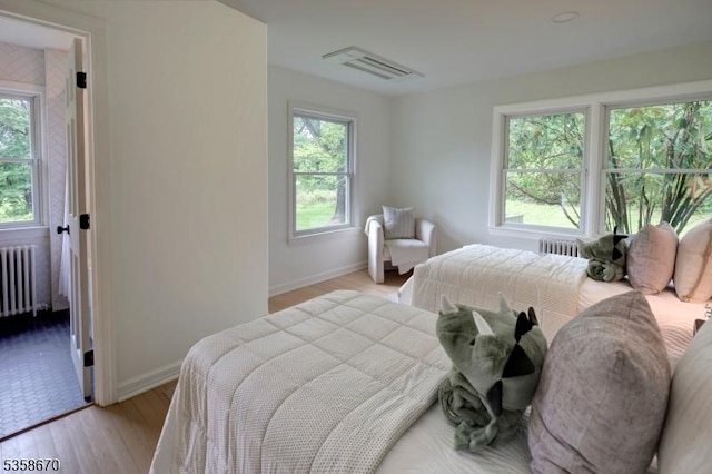 25 Highland Ave, Peapack Gladstone Boro, NJ 07931 - bedroom featuring radiator, baseboards, and light wood-style floors