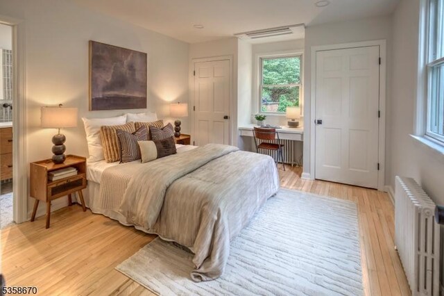 25 Highland Ave, Peapack Gladstone Boro, NJ 07931 - bedroom with radiator and light wood-style flooring