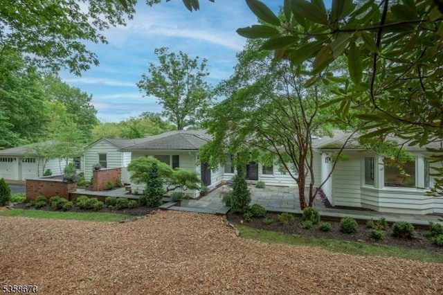 25 Highland Ave, Peapack Gladstone Boro, NJ 07931 - view of front facade featuring a patio