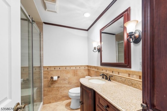 218 Santa Fe Trl, Hopatcong Boro, NJ 07843 - bathroom with ornamental molding, tile walls, a shower stall, vanity, and tile patterned flooring