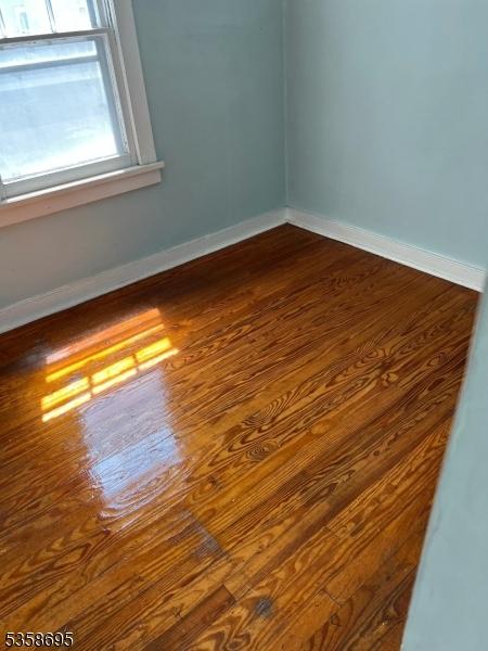 626 Tremont Ave, City Of Orange Twp, NJ 07050 - unfurnished room with dark wood finished floors and baseboards