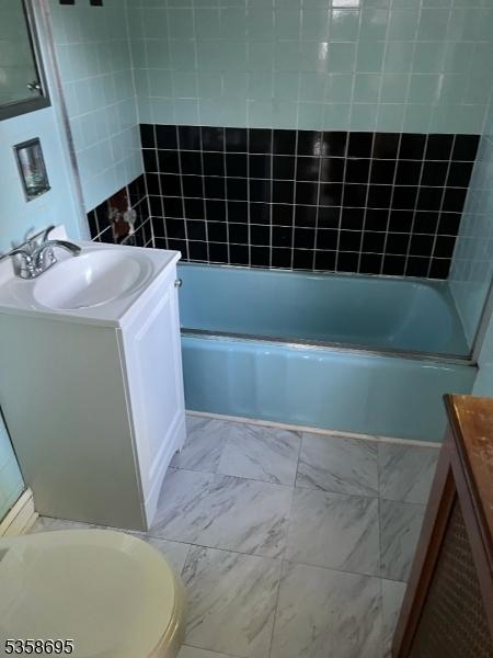 626 Tremont Ave, City Of Orange Twp, NJ 07050 - bathroom featuring vanity, bathtub / shower combination, and toilet