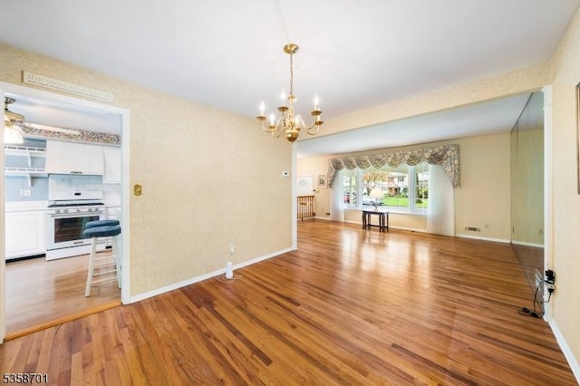 72 Brookside Dr, New Providence Boro, NJ 07974 - unfurnished dining area featuring a chandelier, light wood-type flooring, and baseboards