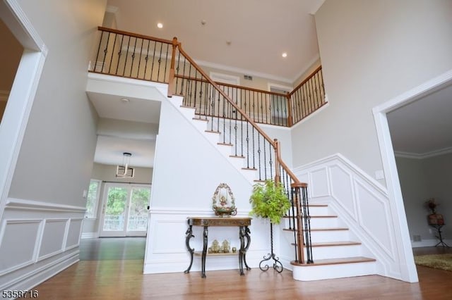236 Berkley Ave, Montgomery Twp, NJ 08502 - staircase with a decorative wall, a towering ceiling, wood finished floors, and a wainscoted wall