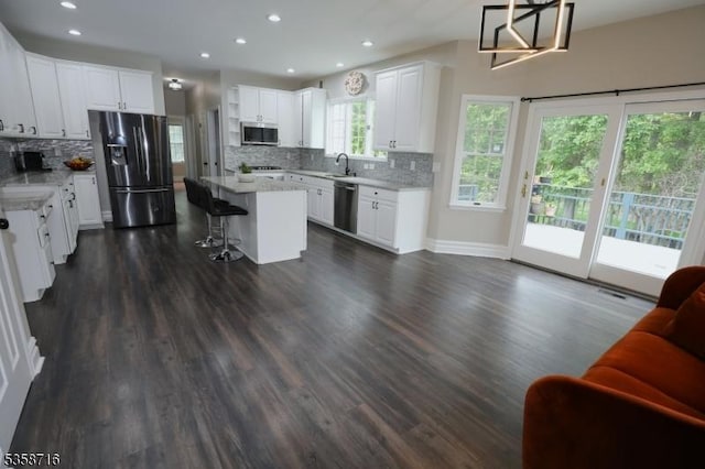 236 Berkley Ave, Montgomery Twp, NJ 08502 - kitchen with appliances with stainless steel finishes, a sink, backsplash, white cabinets, and recessed lighting